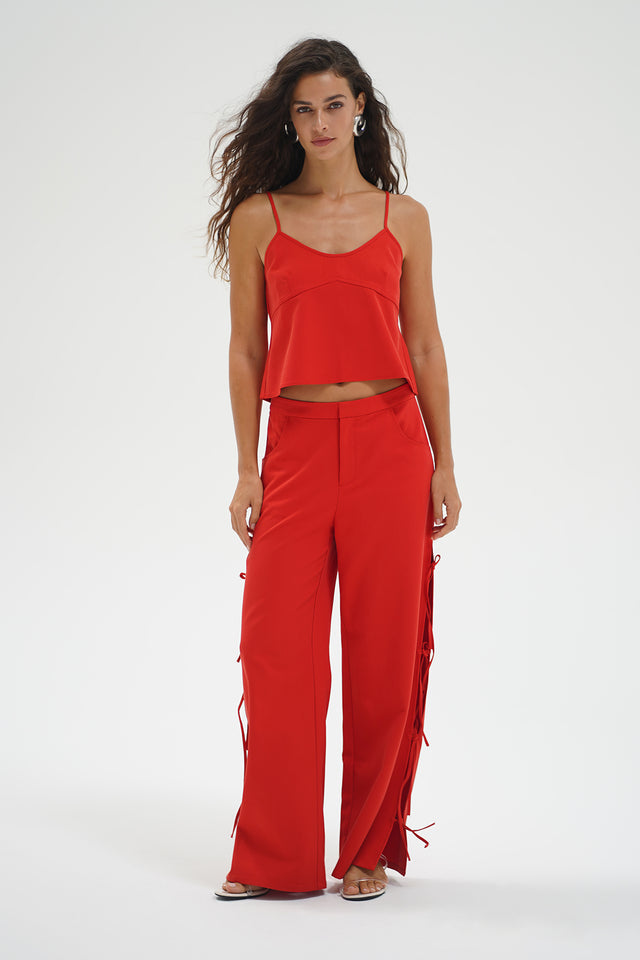 Red chambray tank top and matching wide-leg pants, shown on a woman against a plain white background.
