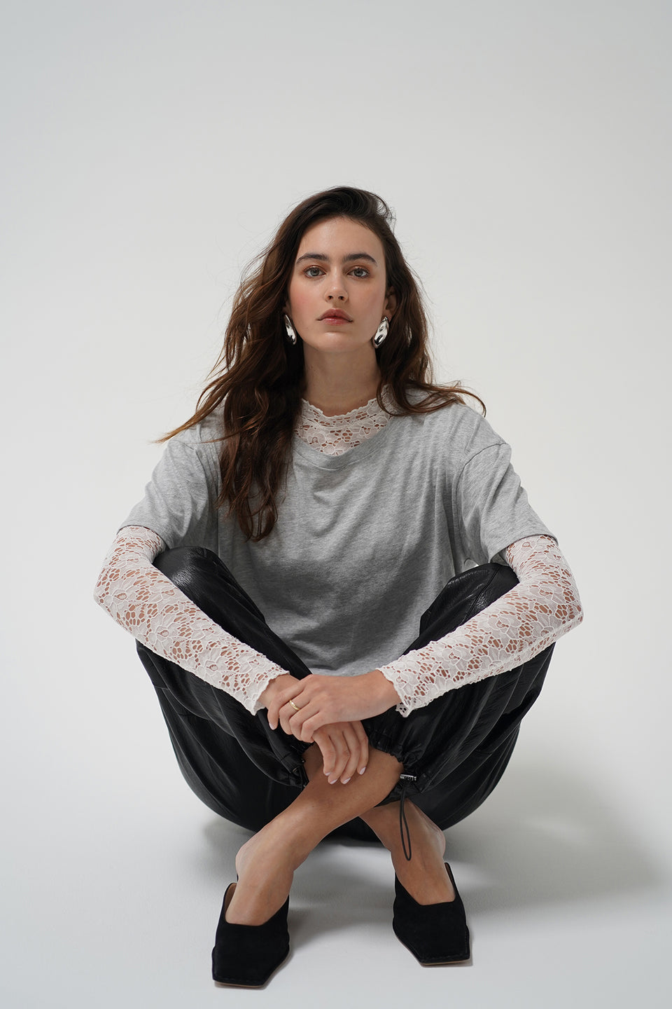 A woman in a two piece lace top