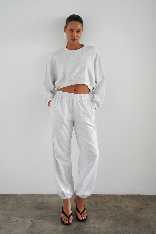 Woman wearing light heather grey sweatpants