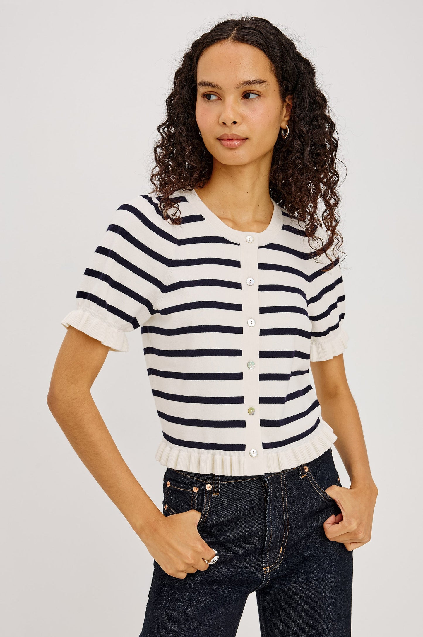 Woman in a navy and white striped button up top
