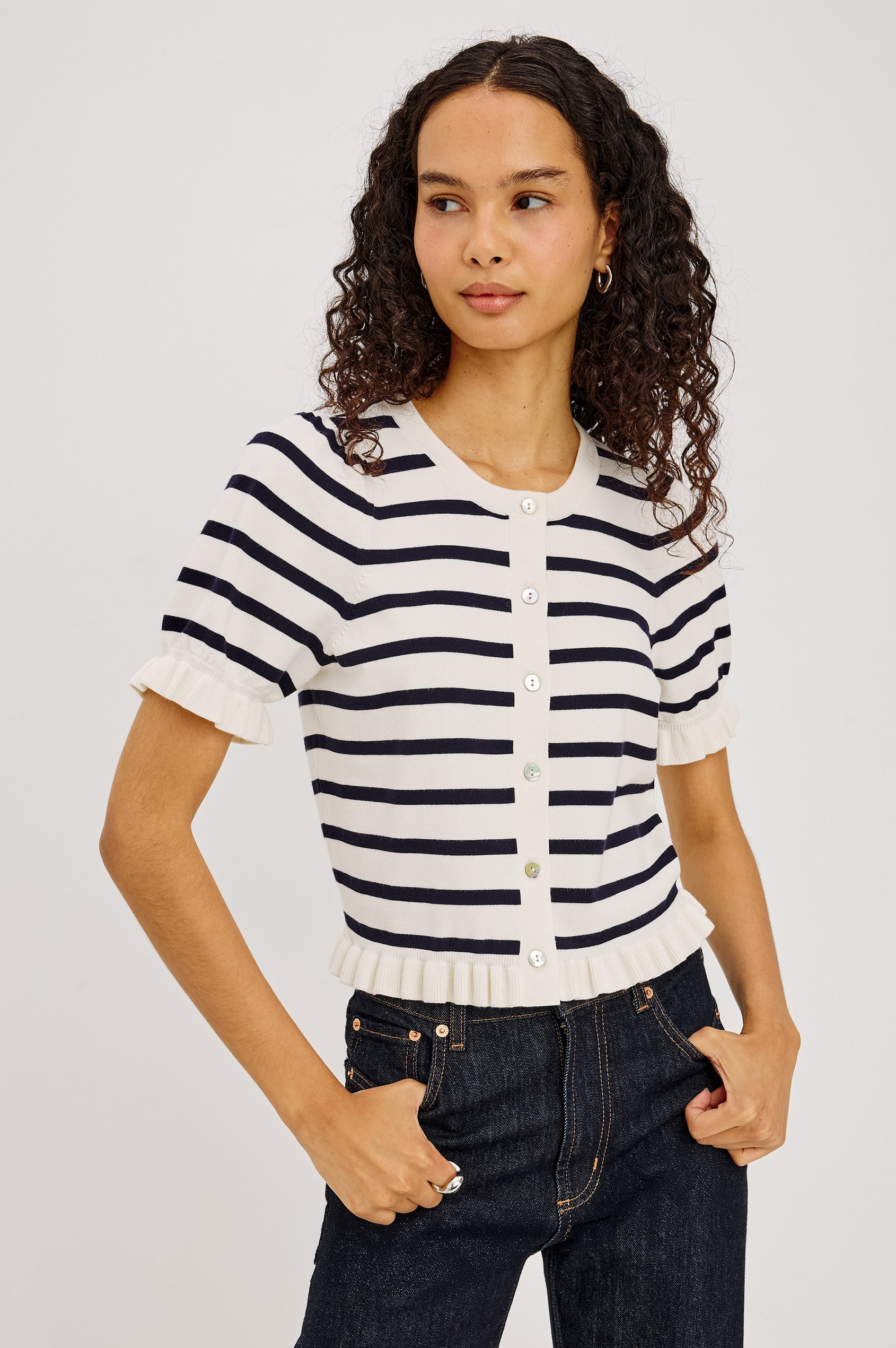 Woman in a navy and white striped button up top