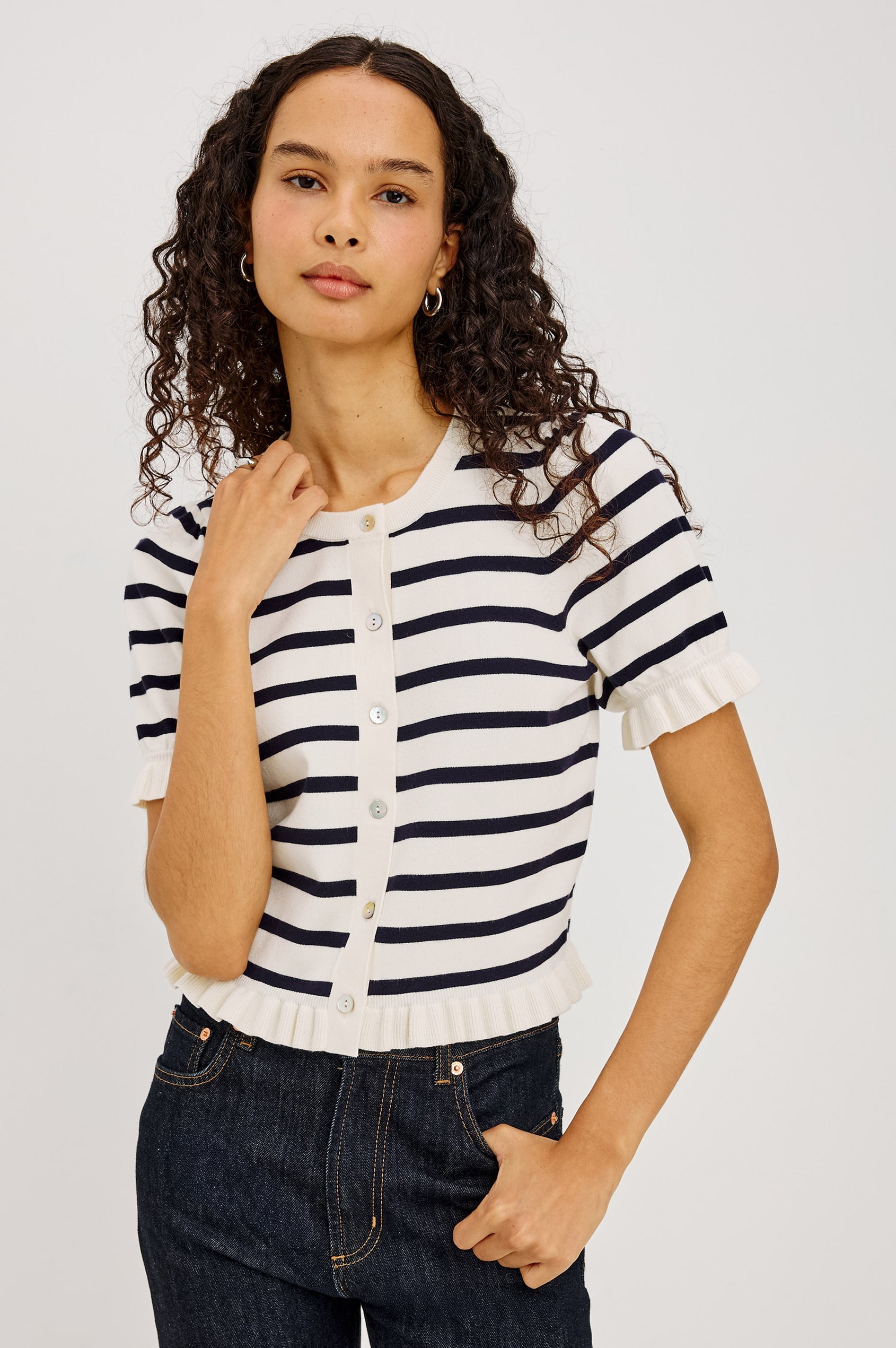 Woman in a navy and white striped button up top