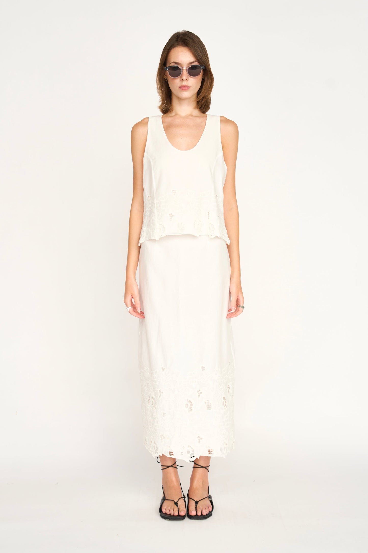Woman in a white embroidered skirt