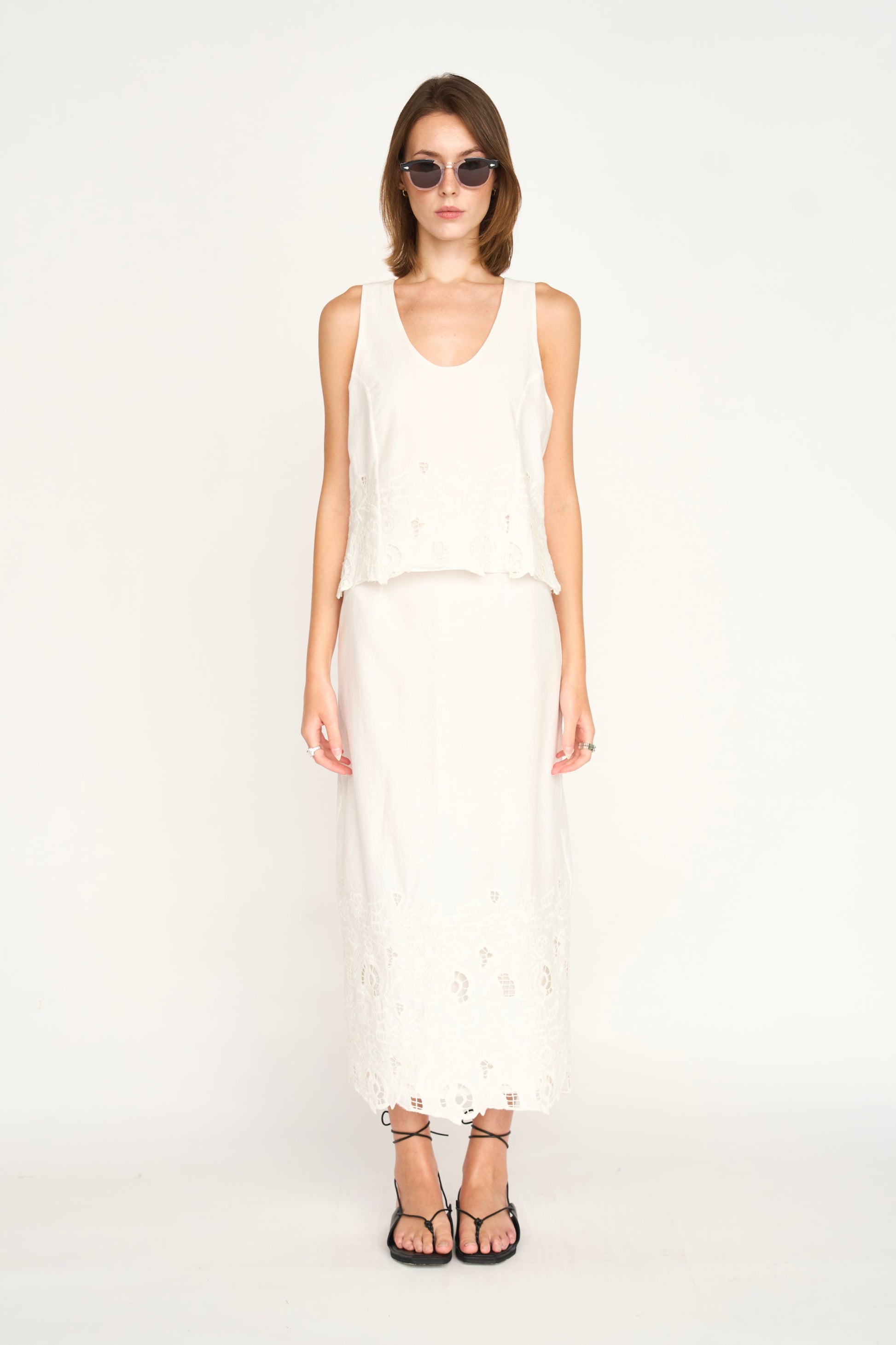 Woman in a white embroidered skirt