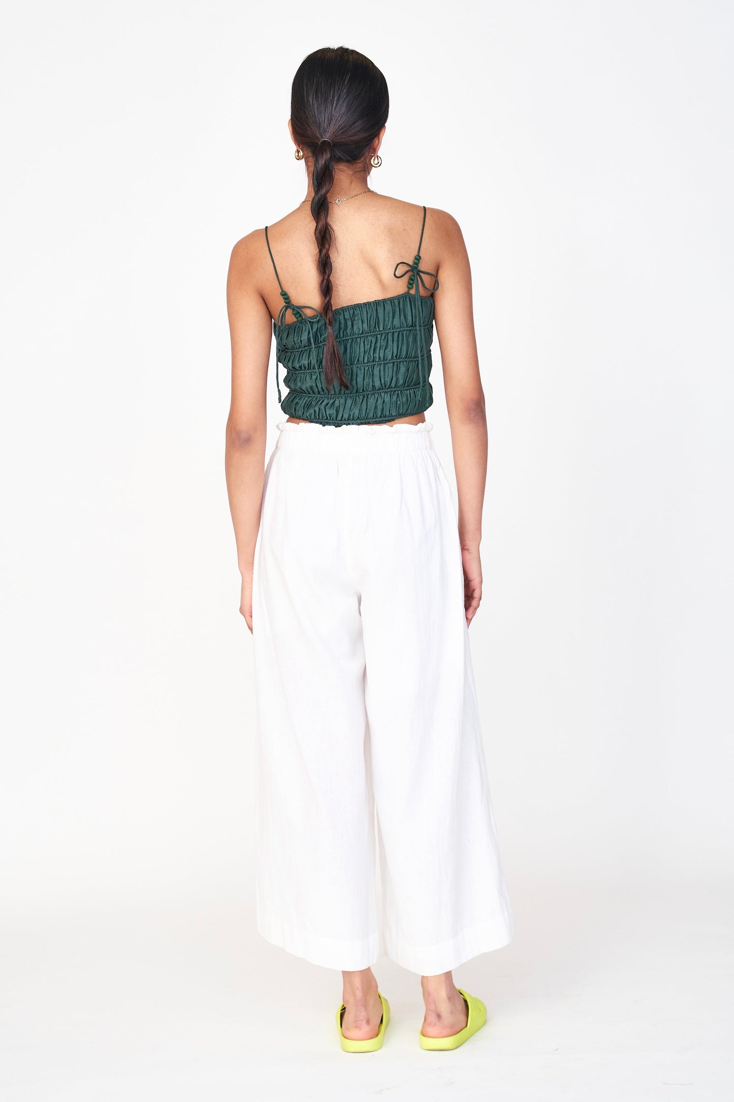 Woman wearing white pants