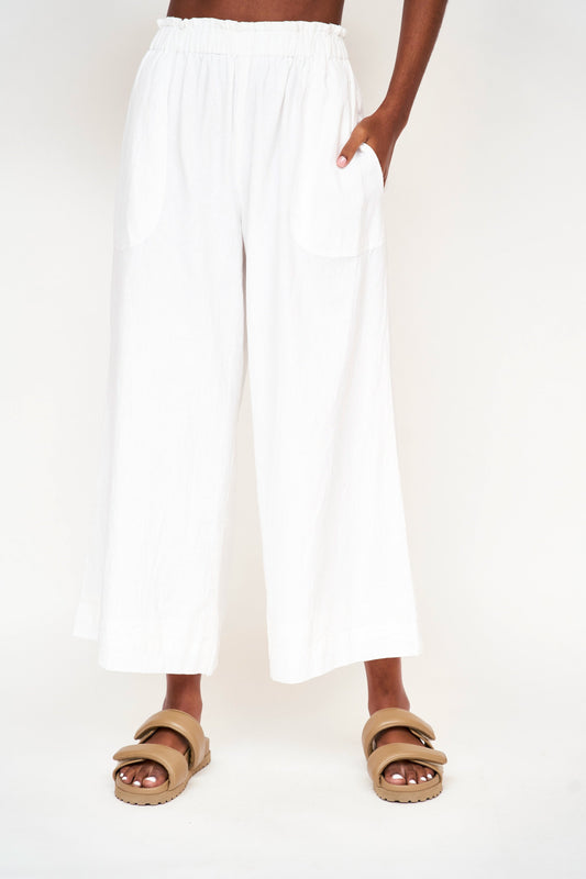 Woman wearing white pants