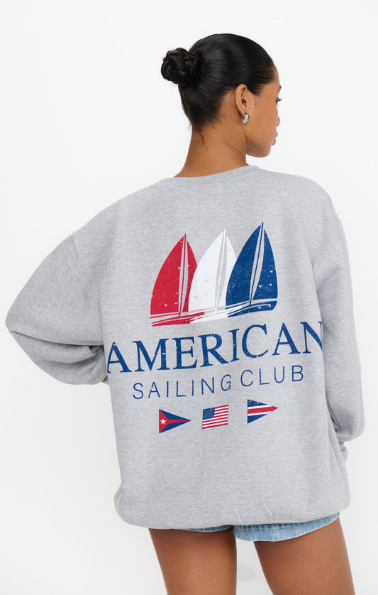 Woman in a graphic grey sweatshirt