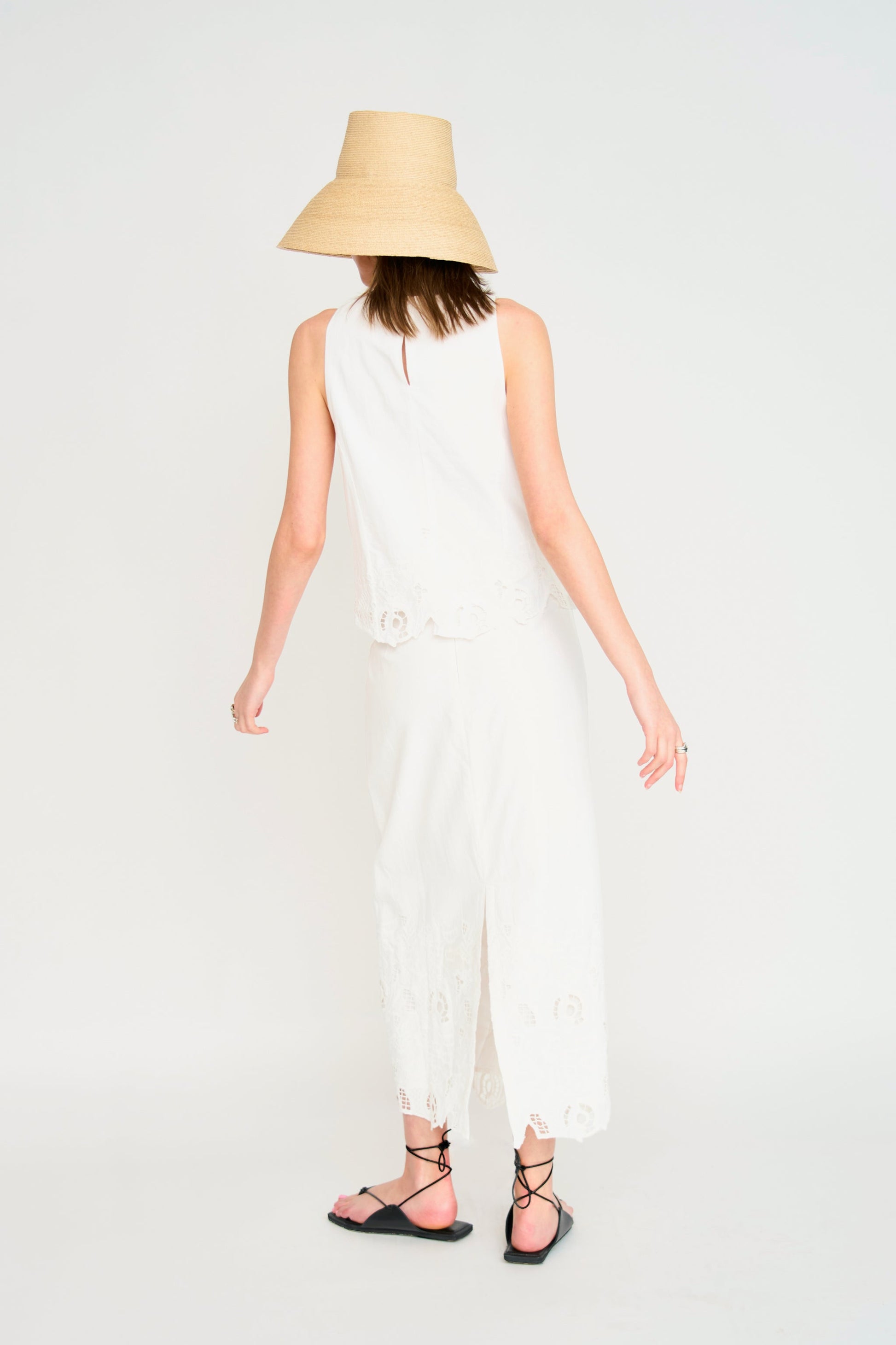 Woman in a white embroidered skirt