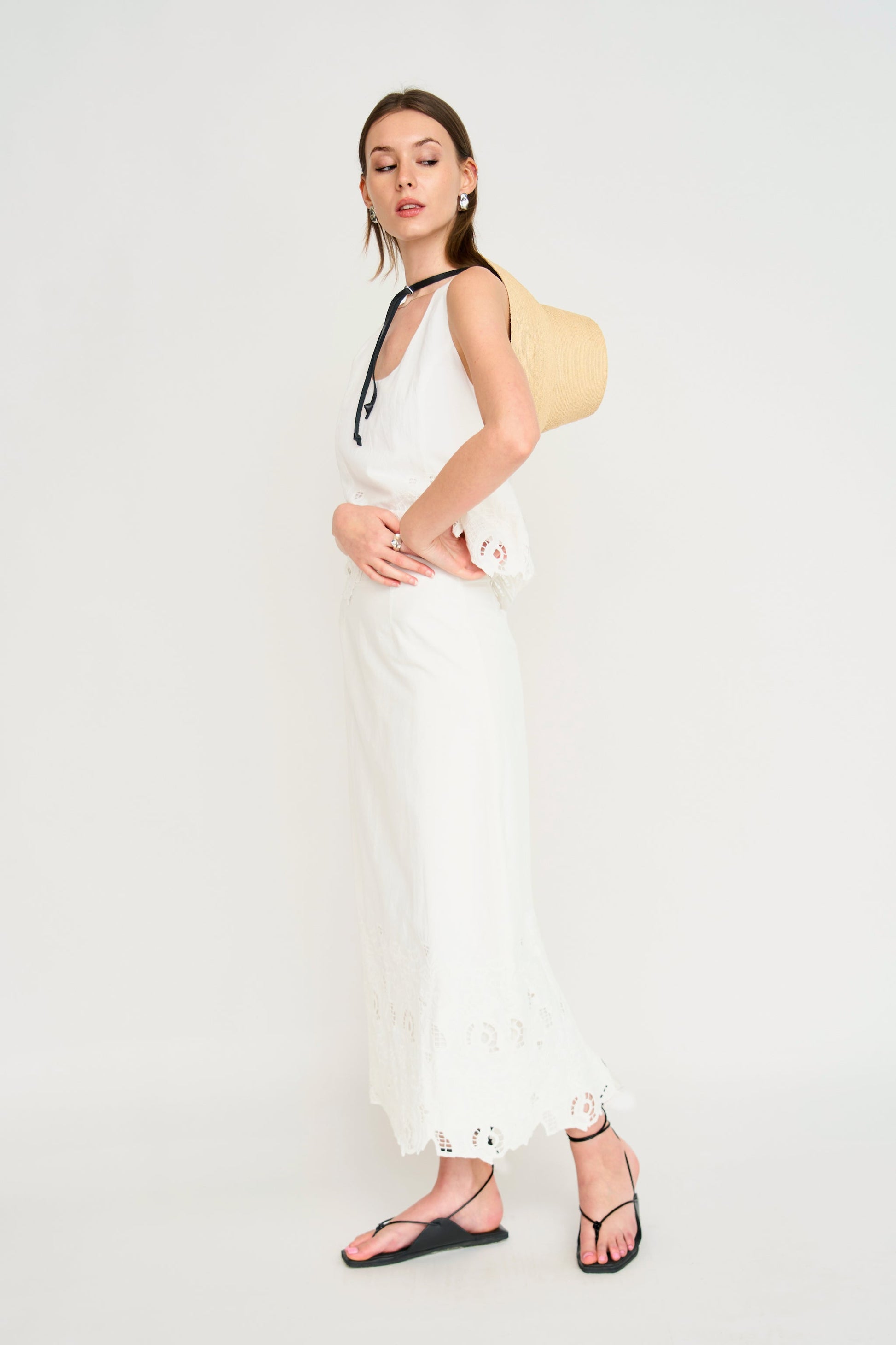 Woman in a white embroidered skirt