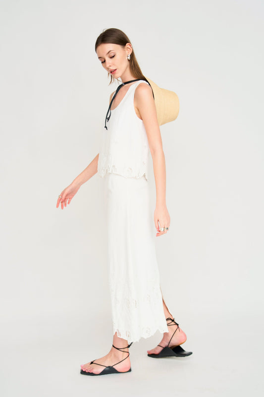 Woman in a white embroidered skirt