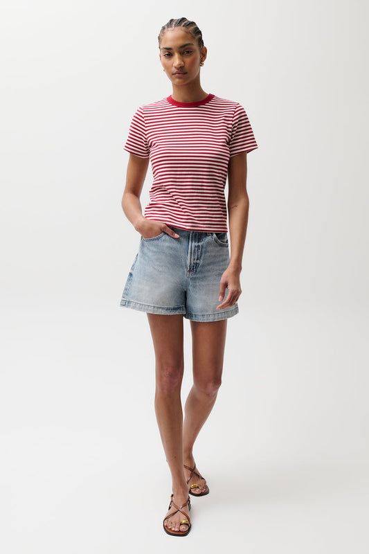Person models light denim shorts and a red striped cotton tee, shown against a plain white background.