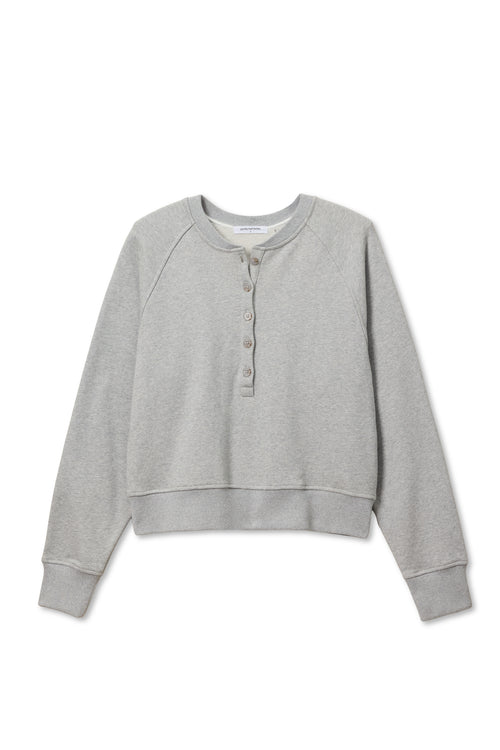 Heather grey fleece sweatshirt with raglan sleeves and a partial button placket, ideal for casual wear.