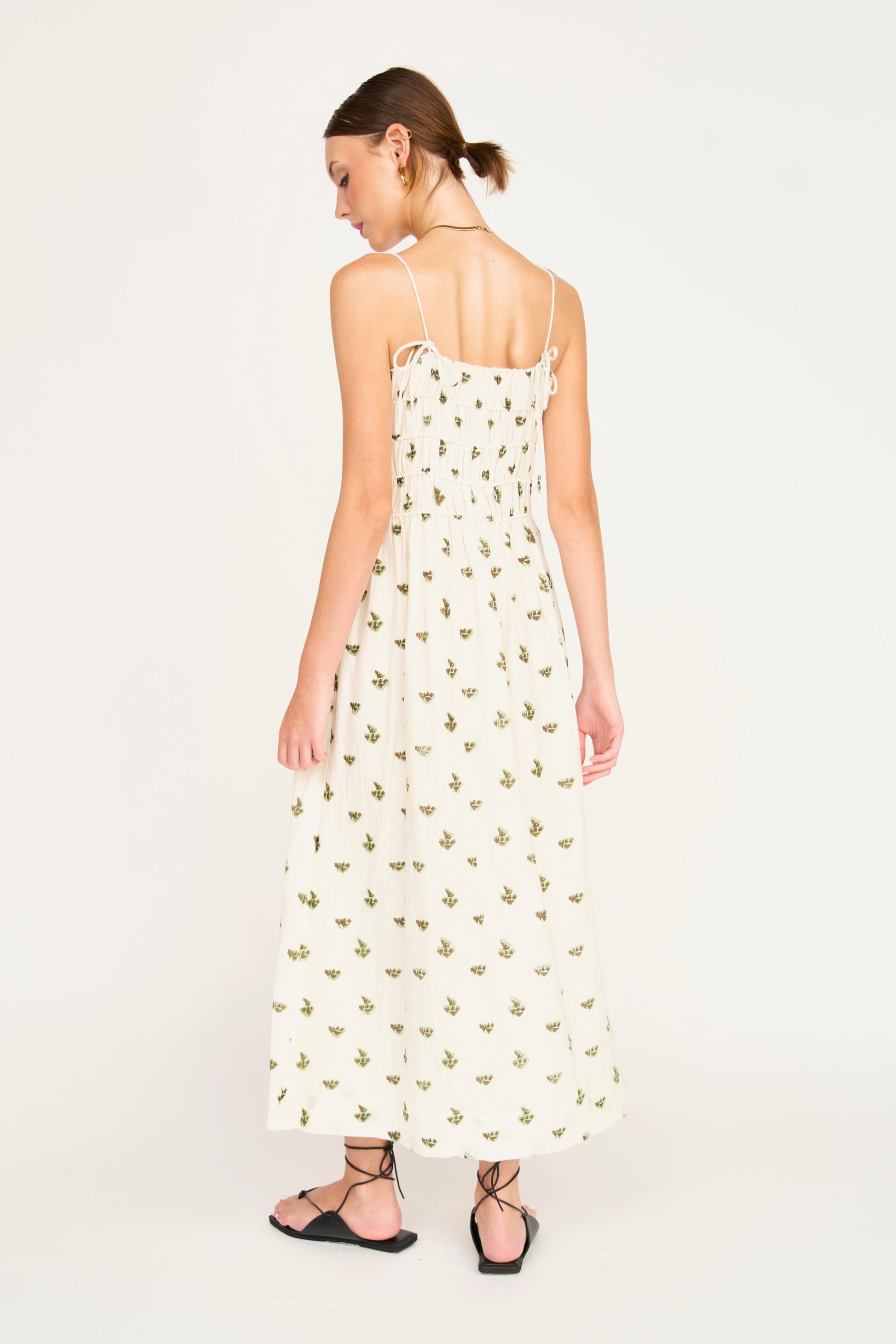 Woman in a white patterned dress