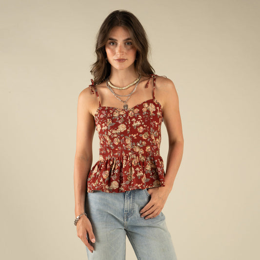 Woman wearing a red floral top