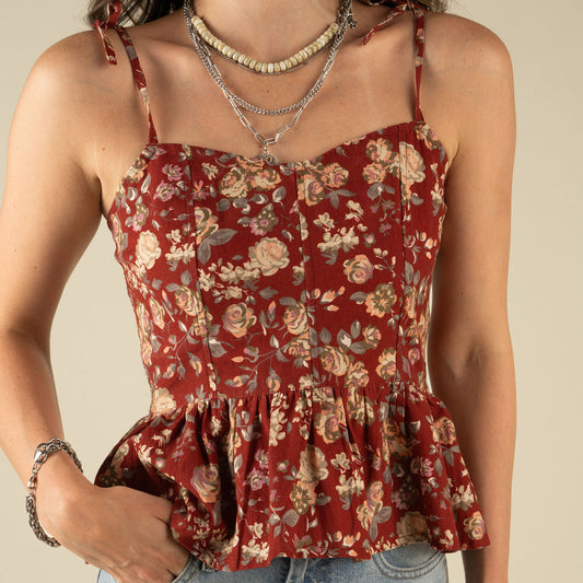 Woman wearing a red floral top