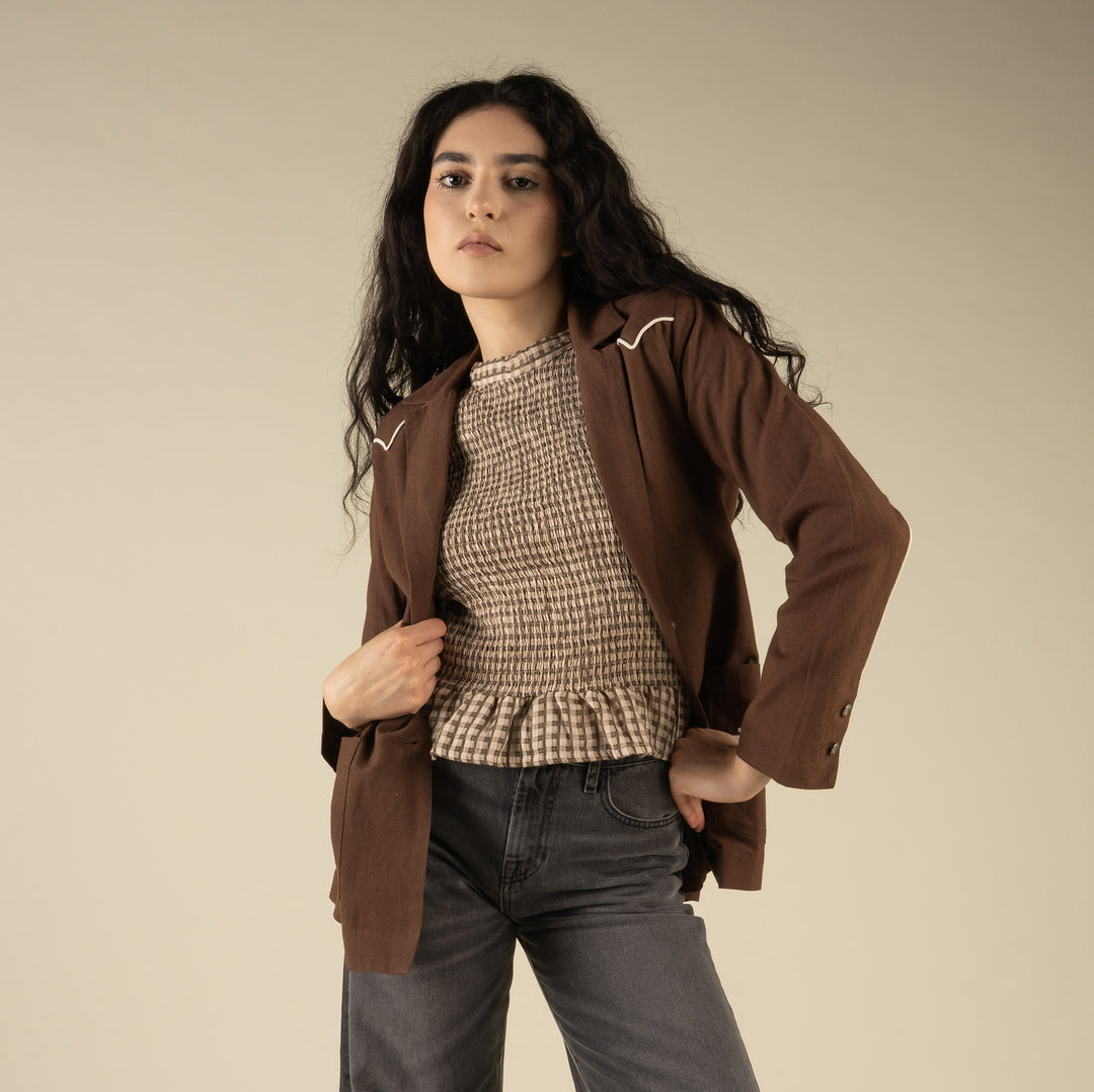 Woman wearing a western brown blazer