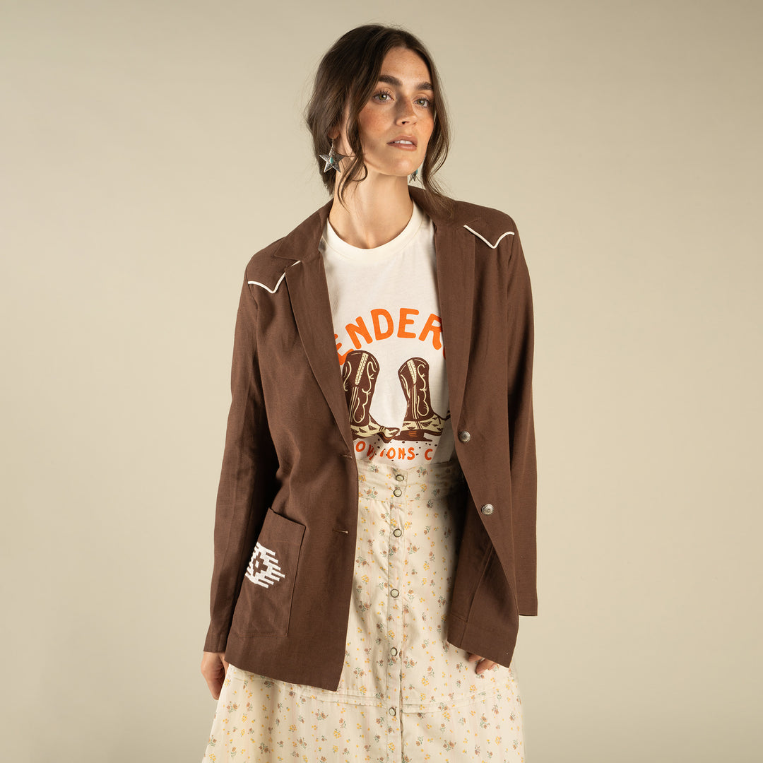 Woman wearing a western brown blazer