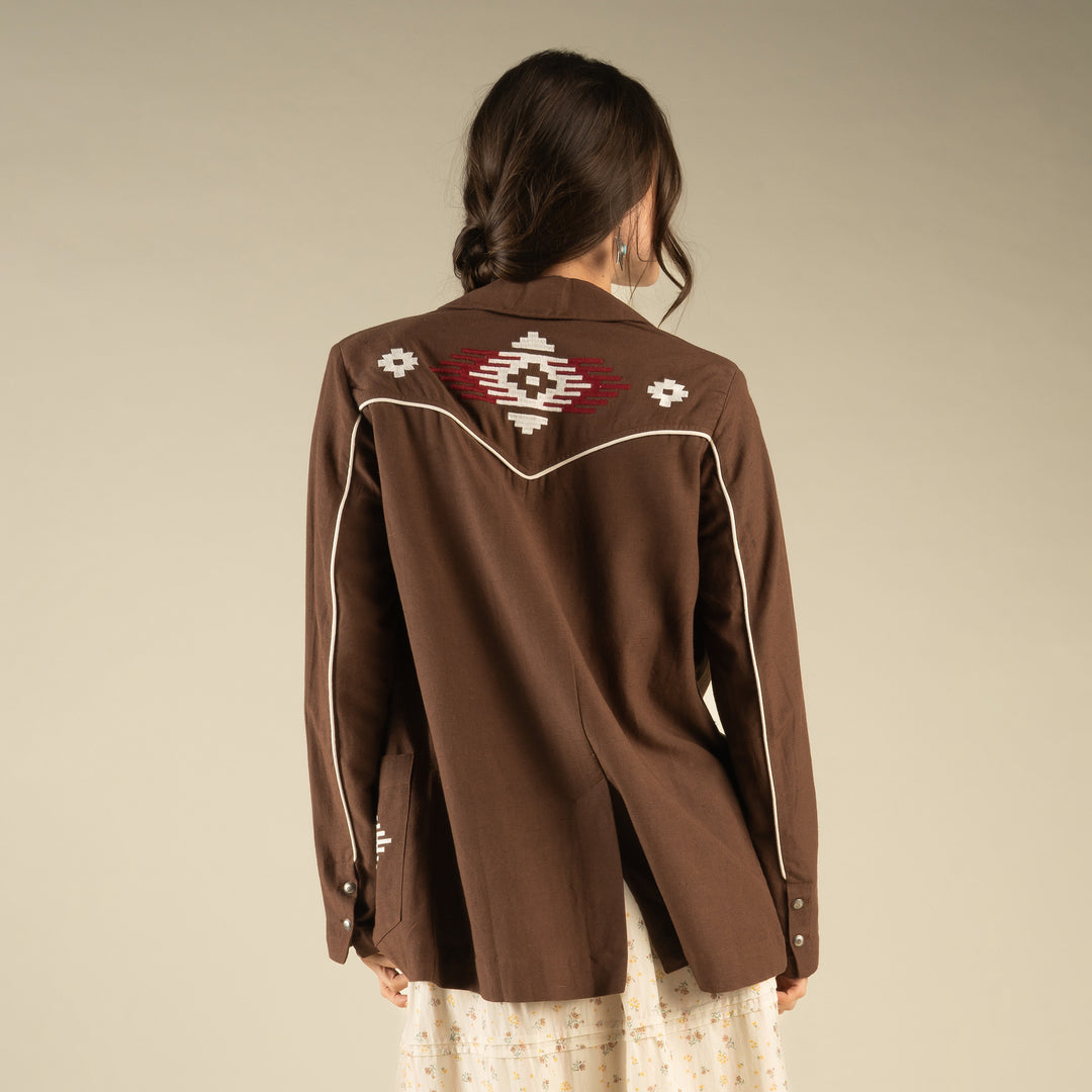 Woman wearing a western brown blazer