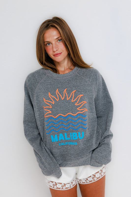 Gray raglan crewneck sweatshirt with white lace-trim shorts, shown on woman standing against a plain background.