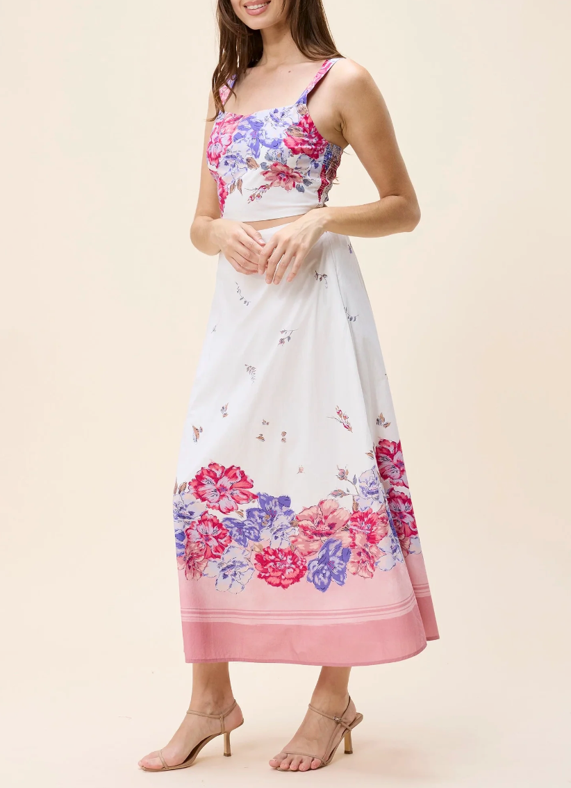 Sleeveless floral blouse in Camellia print, lightweight fabric, handmade in India, suitable for warm weather.