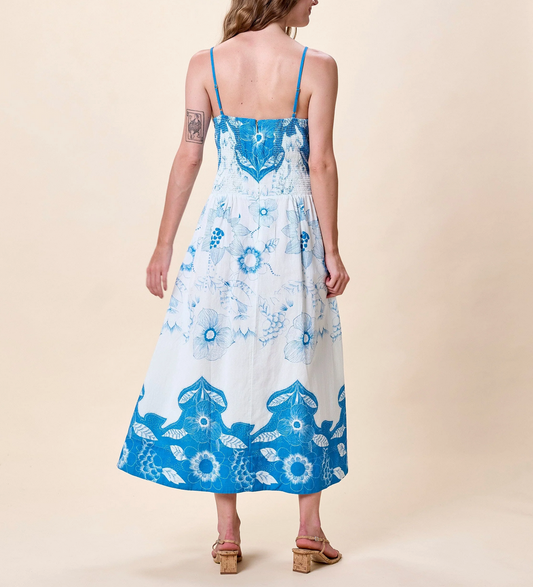 Woman wearing a blue and white floral dress