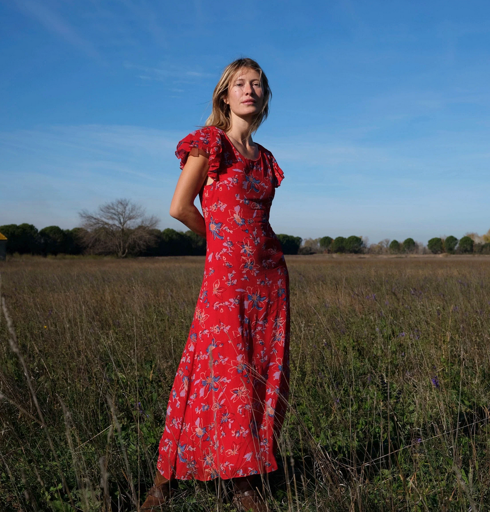 Red floral dress worn by a model 