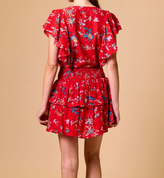 Red floral Arden mini skirt with elastic waist, lightweight fabric, shown from back for casual wear.