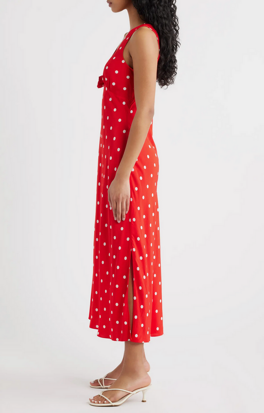 Woman wearing a red polka dot dress