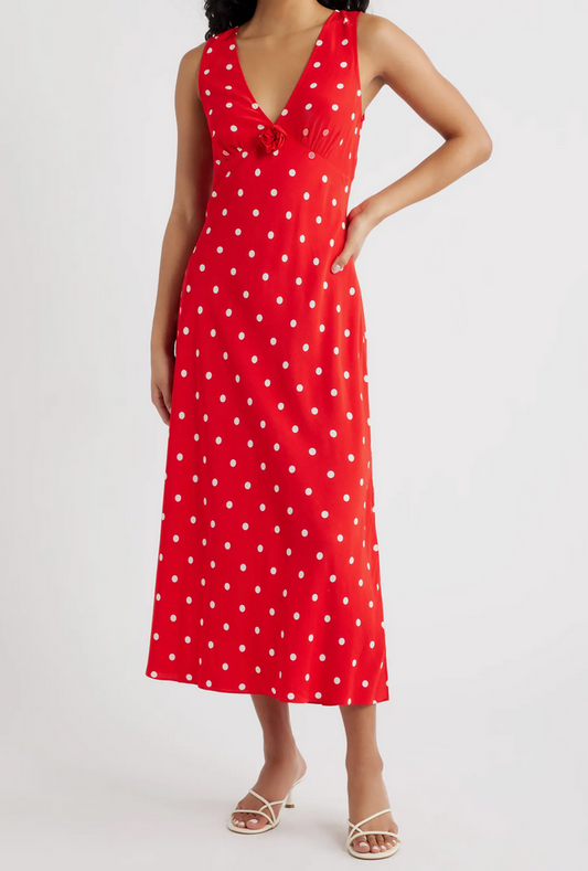 Woman wearing a red polka dot dress