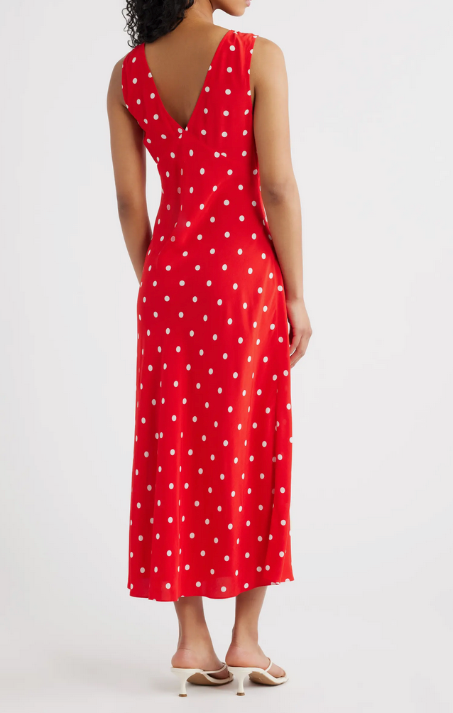 Woman wearing a red polka dot dress