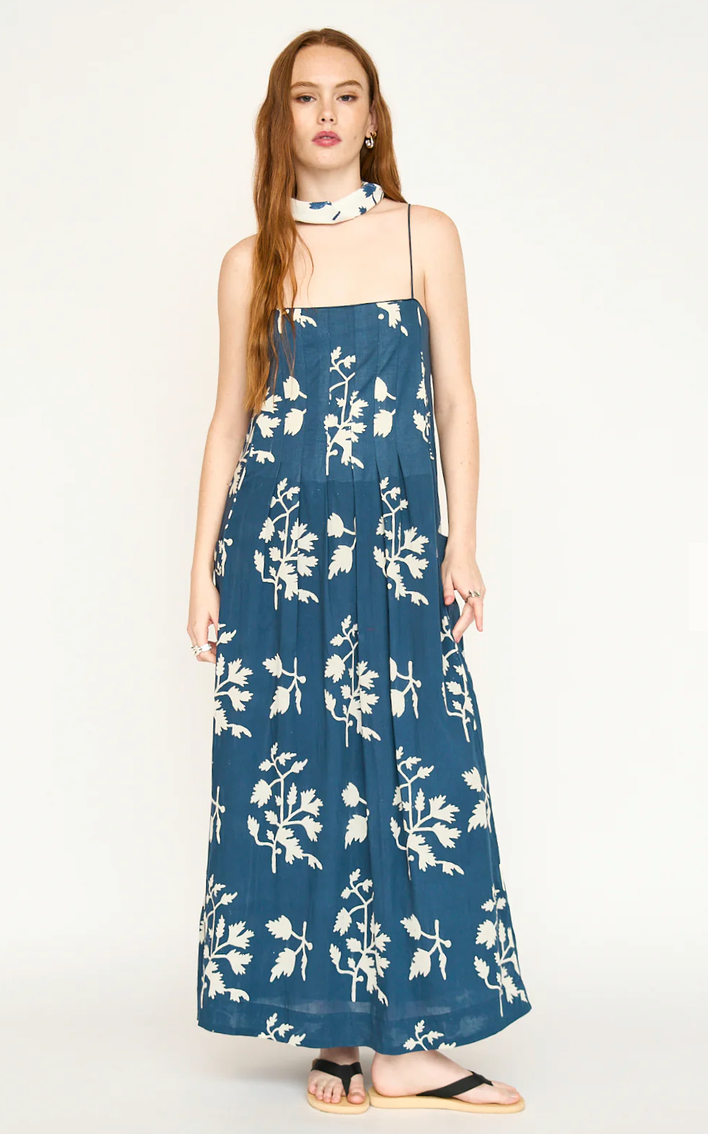Woman in a navy blue floral dress