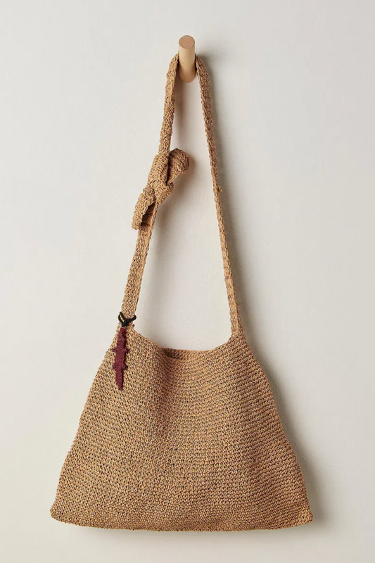 Woven straw bag with a handle