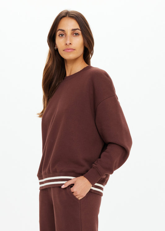 Cocoa crew neck sweater and matching pants in soft knit, featuring white striped cuffs, displayed on a plain white background.