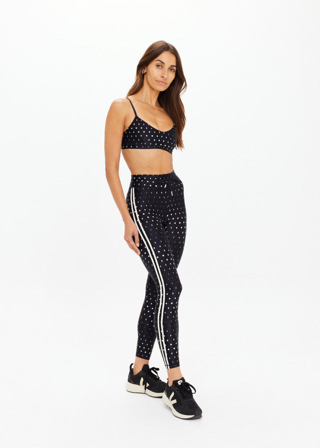 Black 25-inch midi pant made from recycled, super soft fabric; suitable for everyday wear.