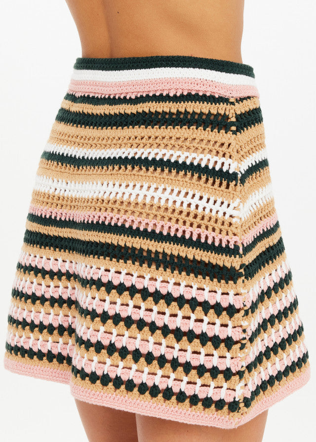 Bohemia crochet mini skirt in pink, black, tan, and white stripes is worn against a plain white background.