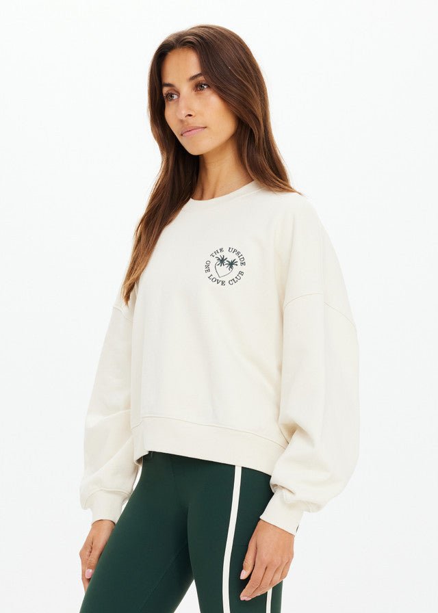 Cream and green crewneck top with matching leggings, soft fabric, suitable for workouts, shown against a white background.