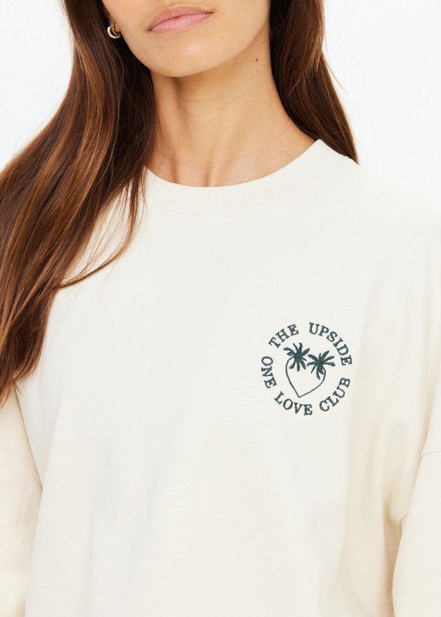Cream crewneck sweatshirt with palm tree and One Love Club chest graphic; ideal for casual wear.