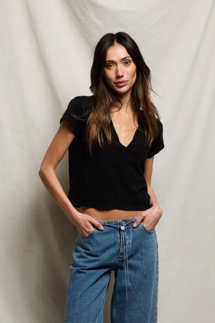 Woman in a black v neck tee