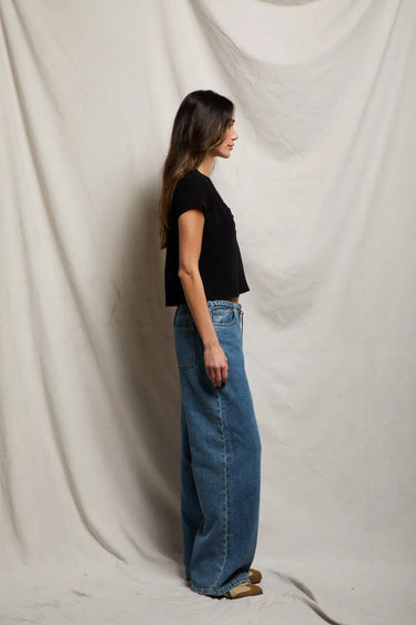 Woman in a black v neck tee