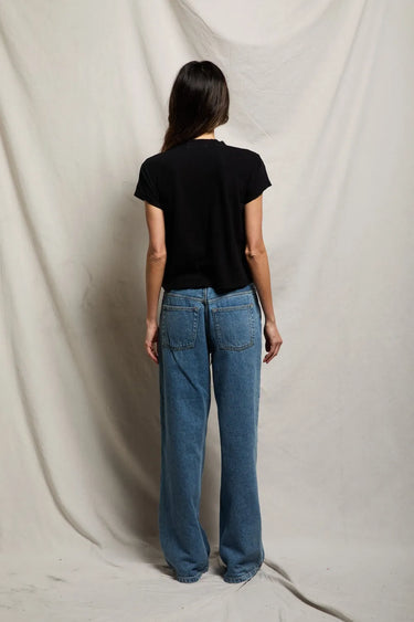 Woman in a black v neck tee