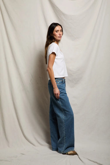 Woman in white v neck tee