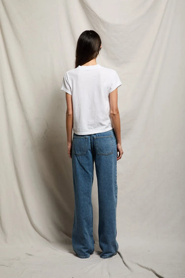 Woman in white v neck tee