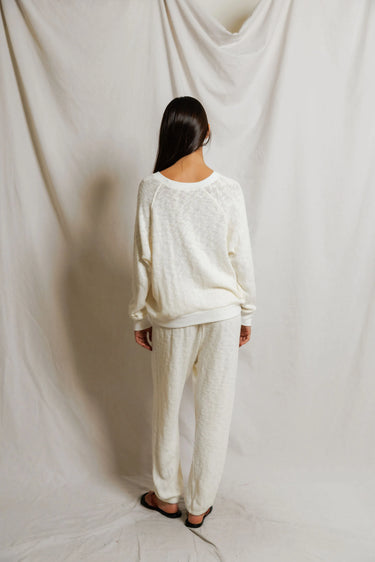 Woman in a white sweater