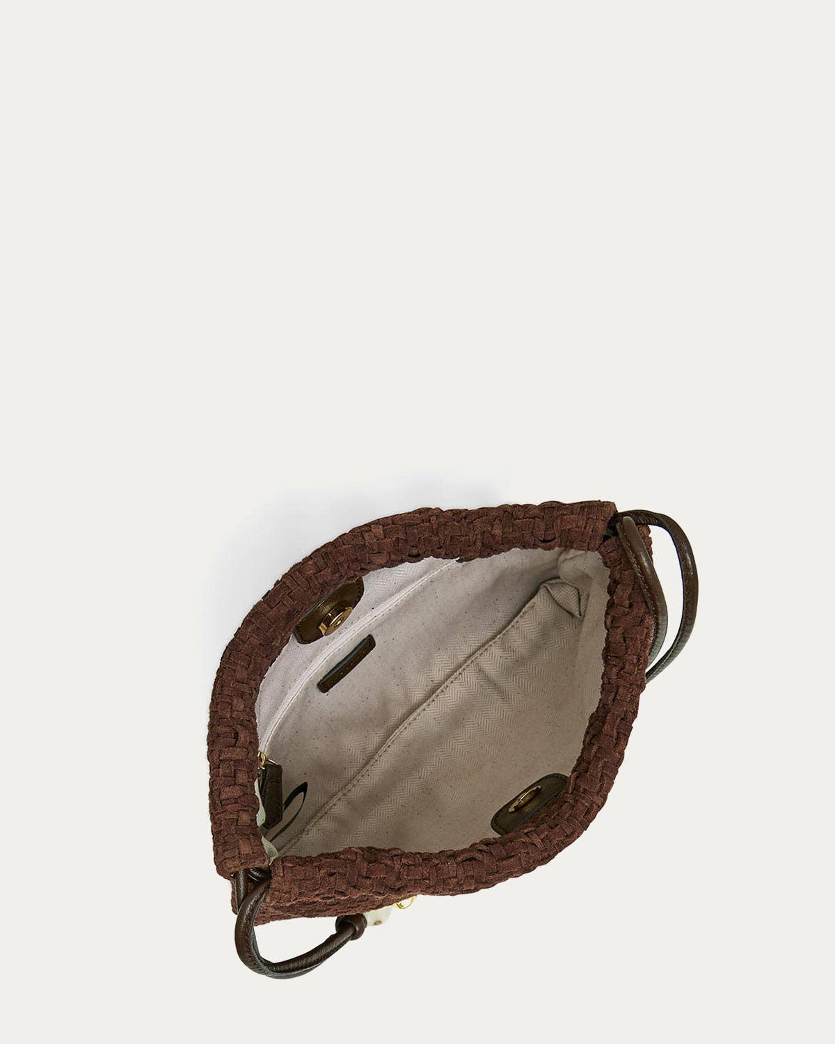 A beige-lined woven shoulder bag with brown handles, shown from above; suitable for everyday or casual use.
