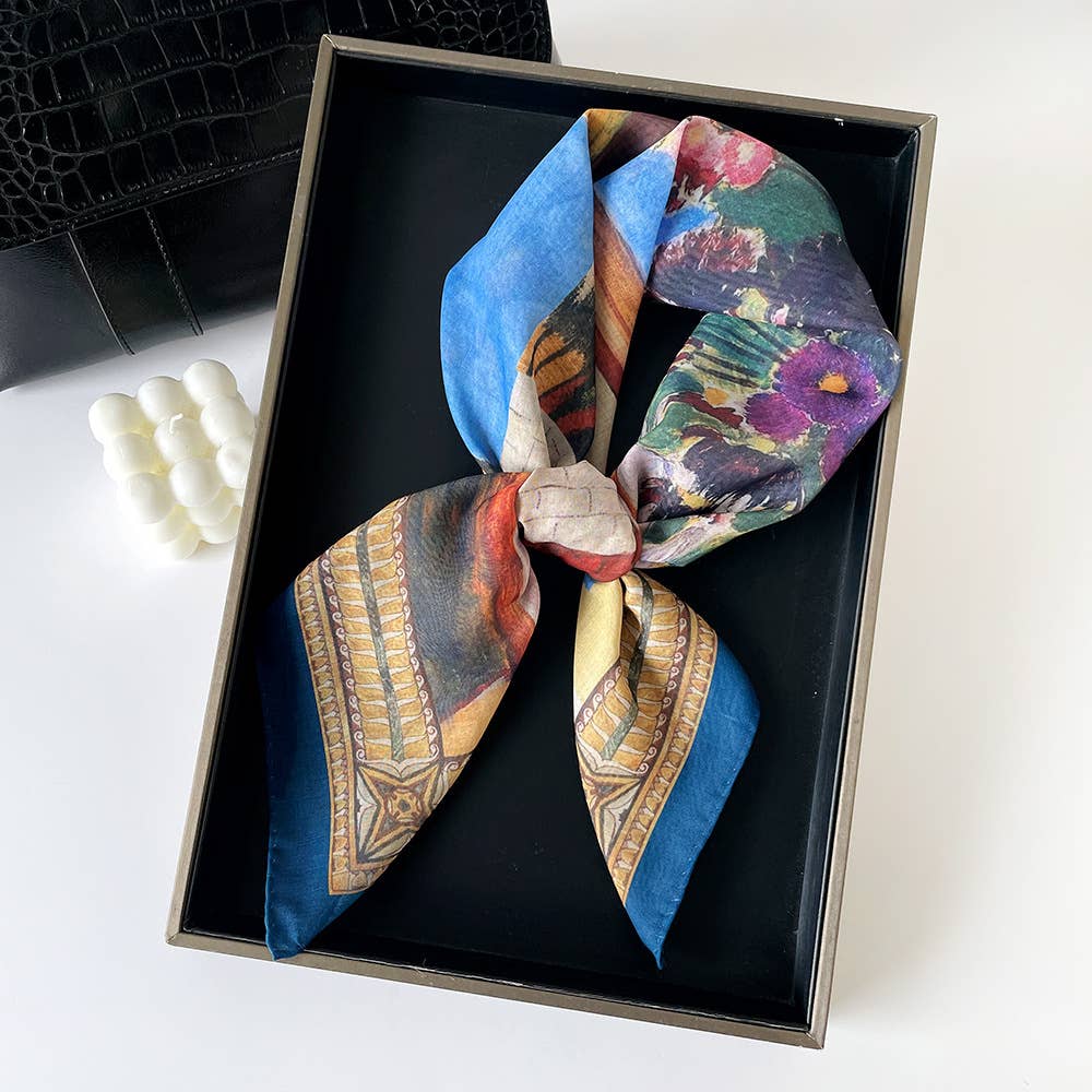 Multicolored paisley patchwork bandana scarf, likely cotton, displayed in a black box. Suitable as an accessory or gift.
