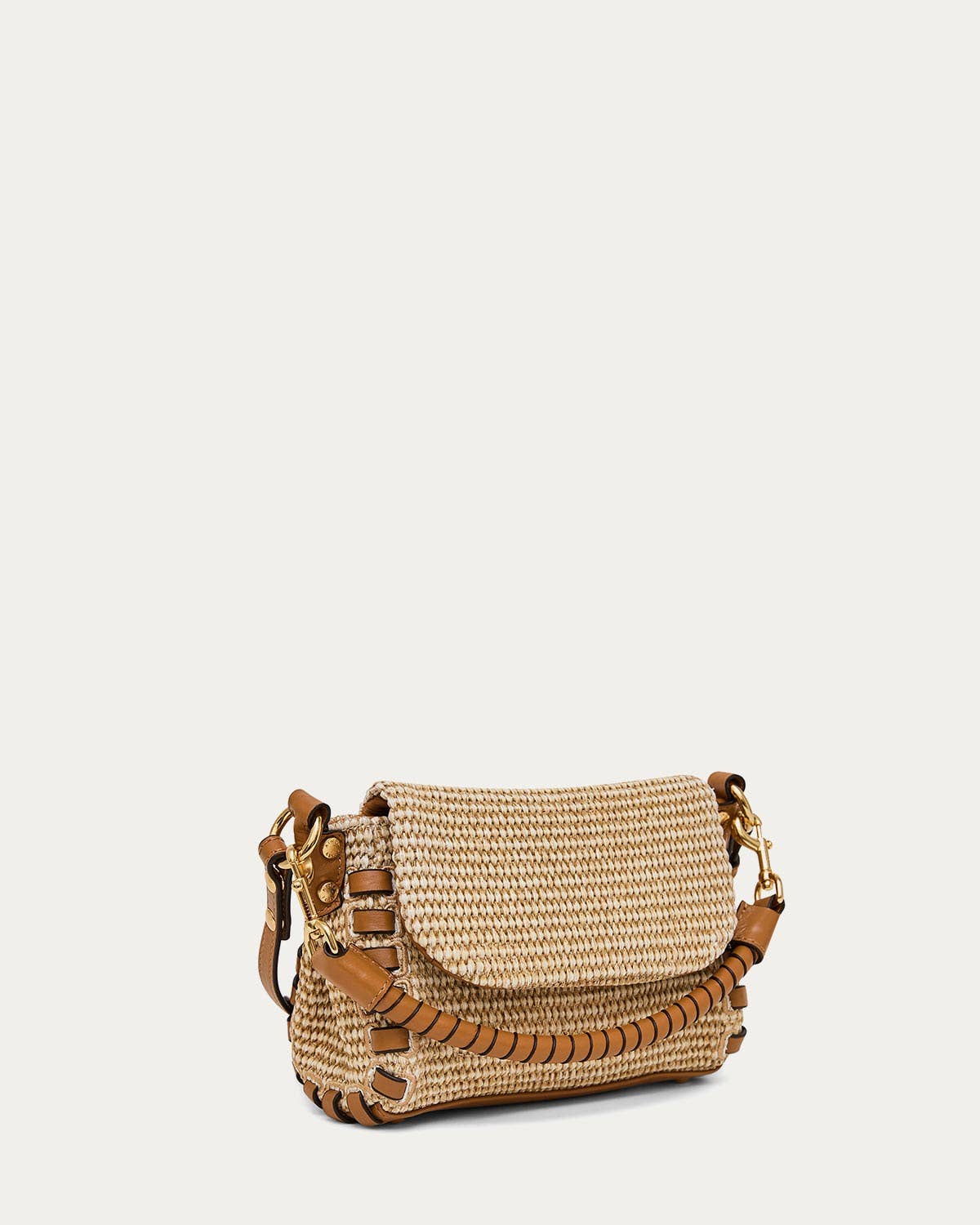 Tan woven crossbody bag with leather trim, flap closure, and adjustable strap for hands-free carrying.
