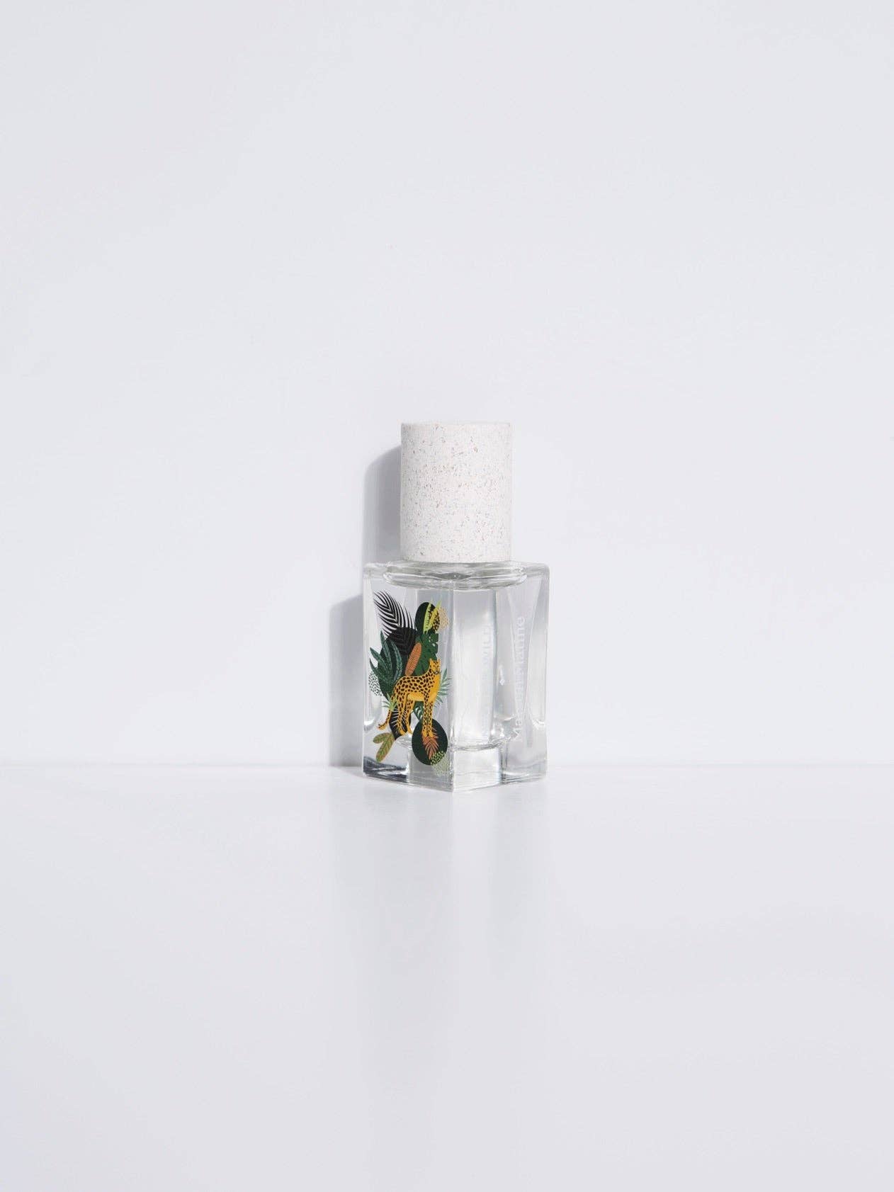 Clear glass bottle with white cap, 15ml; holds Maison Matines woody, spicy Into The Wild Eau de Parfum.