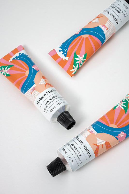 Three colorful 30ml Longe Côte hand cream tubes with graphic designs rest on a white surface.