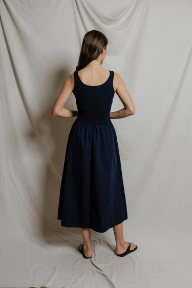 Woman in a navy midi dress