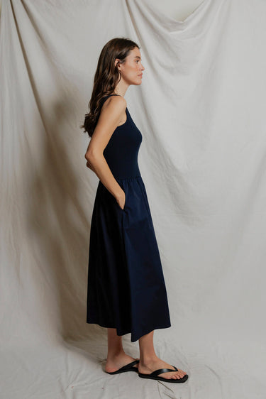 Woman in a navy midi dress